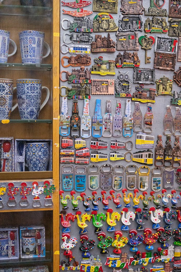 services-img A colorful assortment of Lisbon souvenirs including magnets and mugs on display.