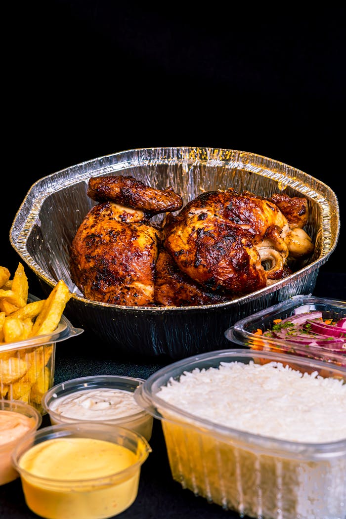 The Art of Drawing Readers In: Your attractive post title goes here Succulent roasted chicken with fries, rice, and sauces for a tasty meal.