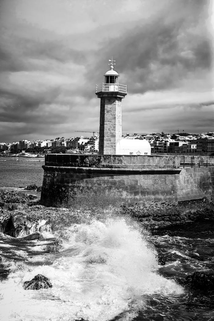 Mastering the First Impression: Your intriguing post title goes here Majestic lighthouse with ocean waves crashing in Matosinhos, Portugal.